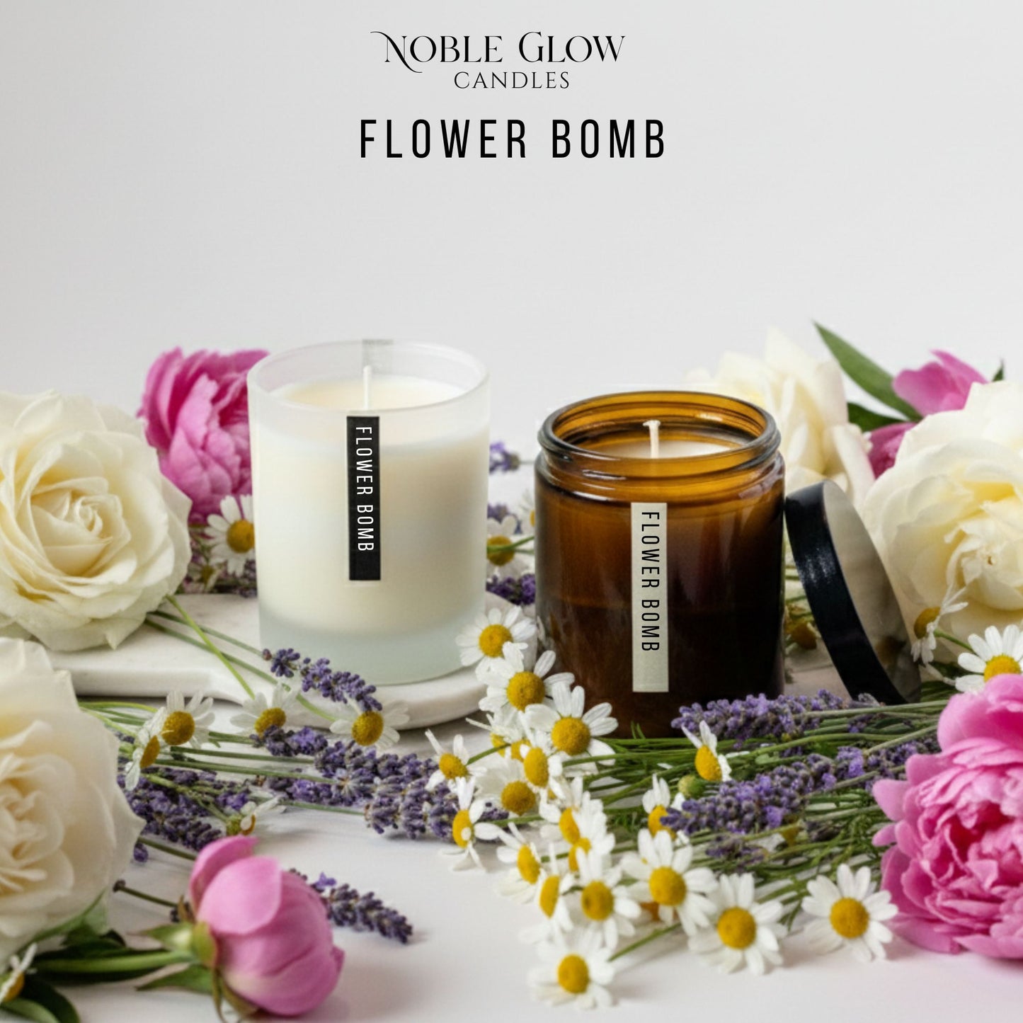 Two candles labeled 'Flower Bomb' surrounded by flowers on a light background