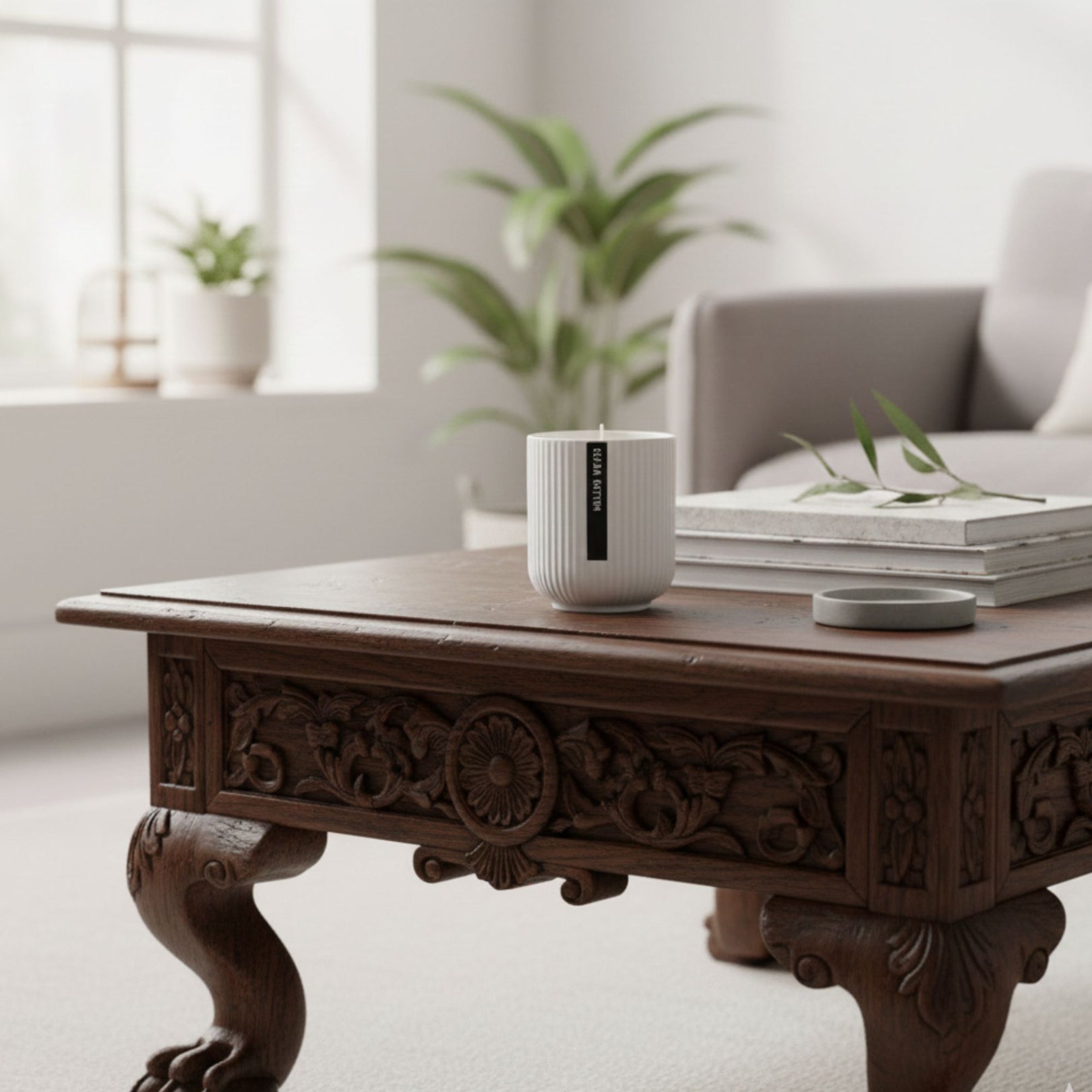 Decorative wooden coffee table with a candle and books in a living room setting
