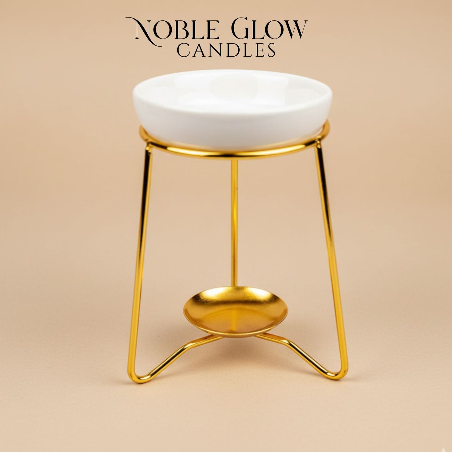 Gold candle holder with white bowl on a beige background, featuring 'Noble Glow Candles' branding.
